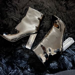 Patent leather peep toe booties with clear 4 inch block heel. Never been worn.